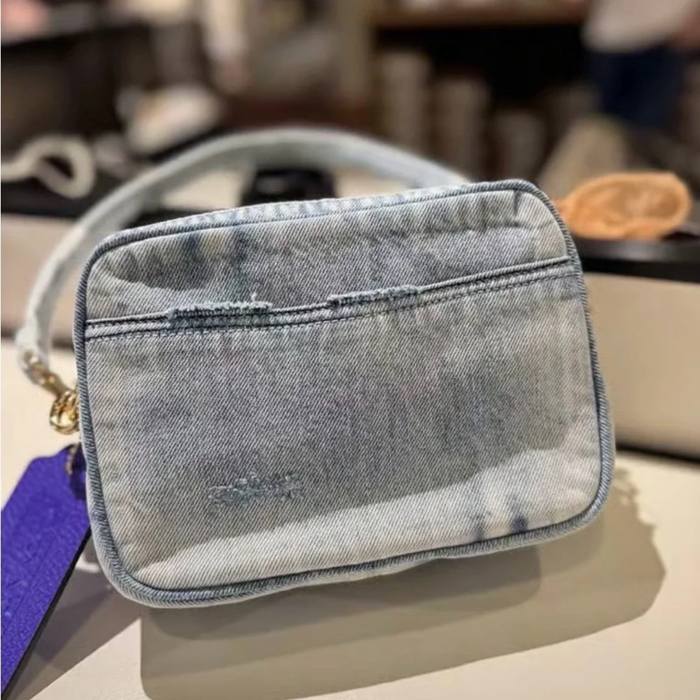 Coach Light Denim Crossbody with Purple Tag and Red Charm